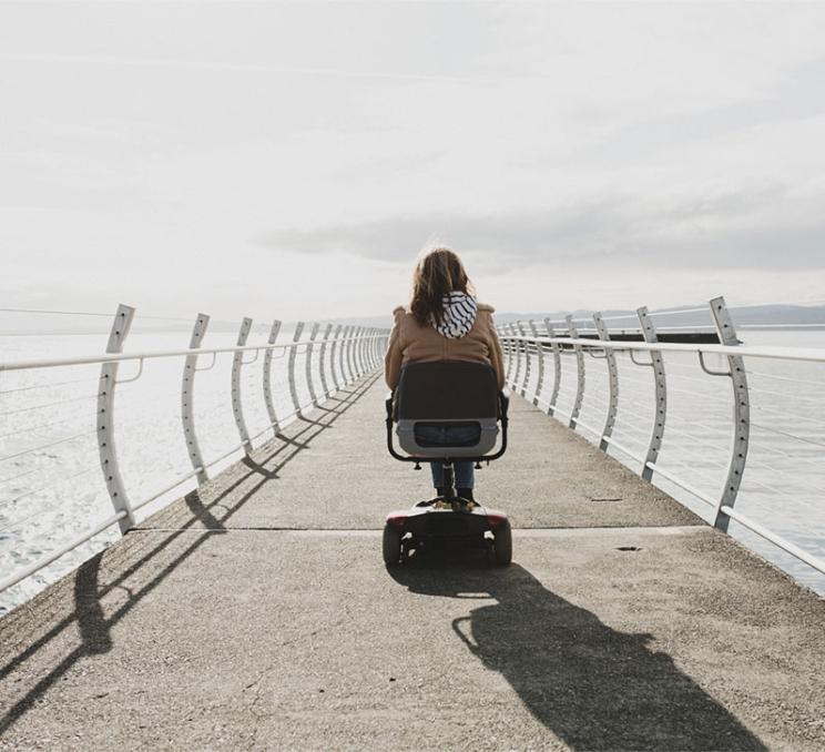 An accessible needs traveller explores the Ogden Point Breakwater in Victoria, BC